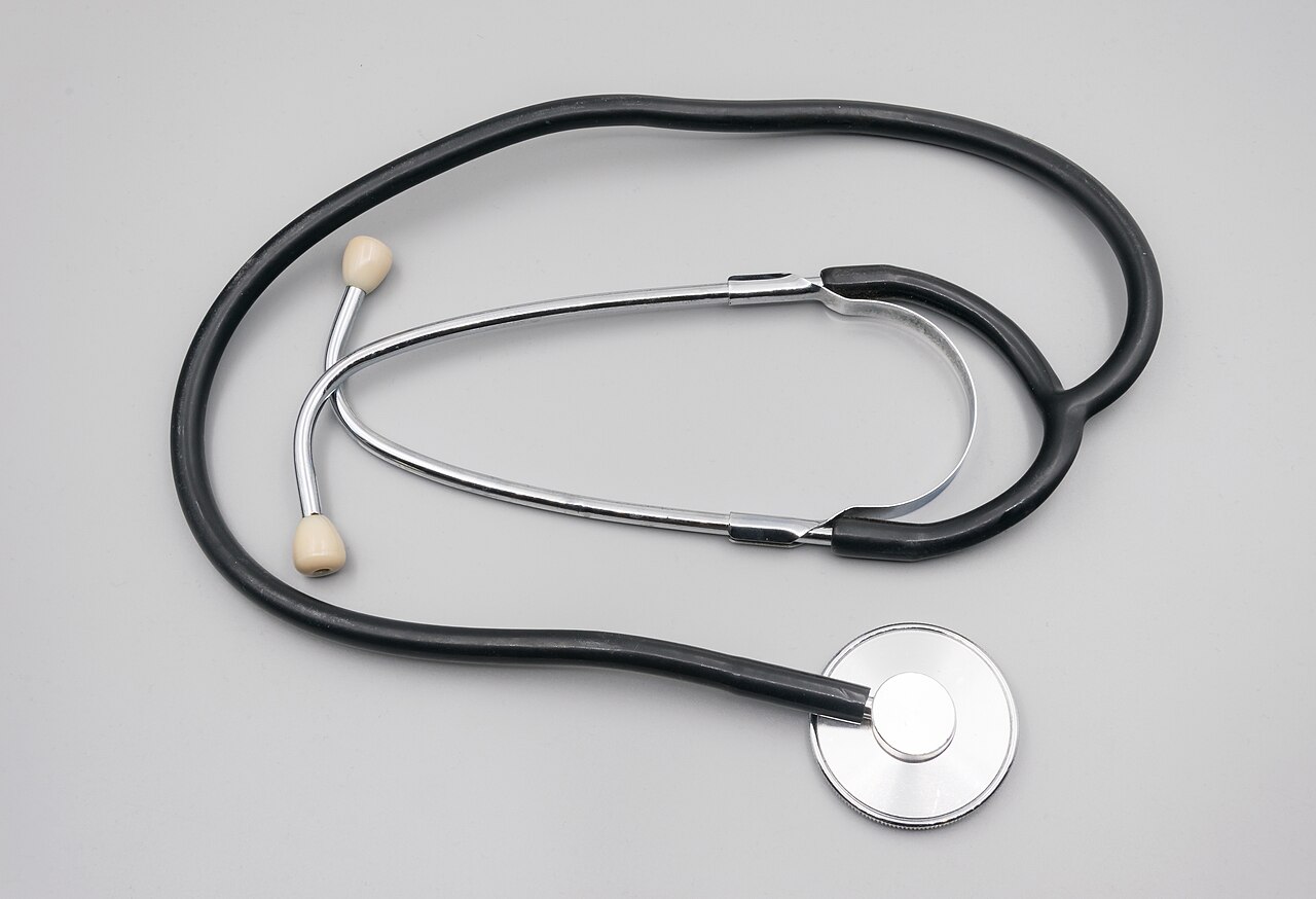 A black stethoscope, the classic symbol of a doctor