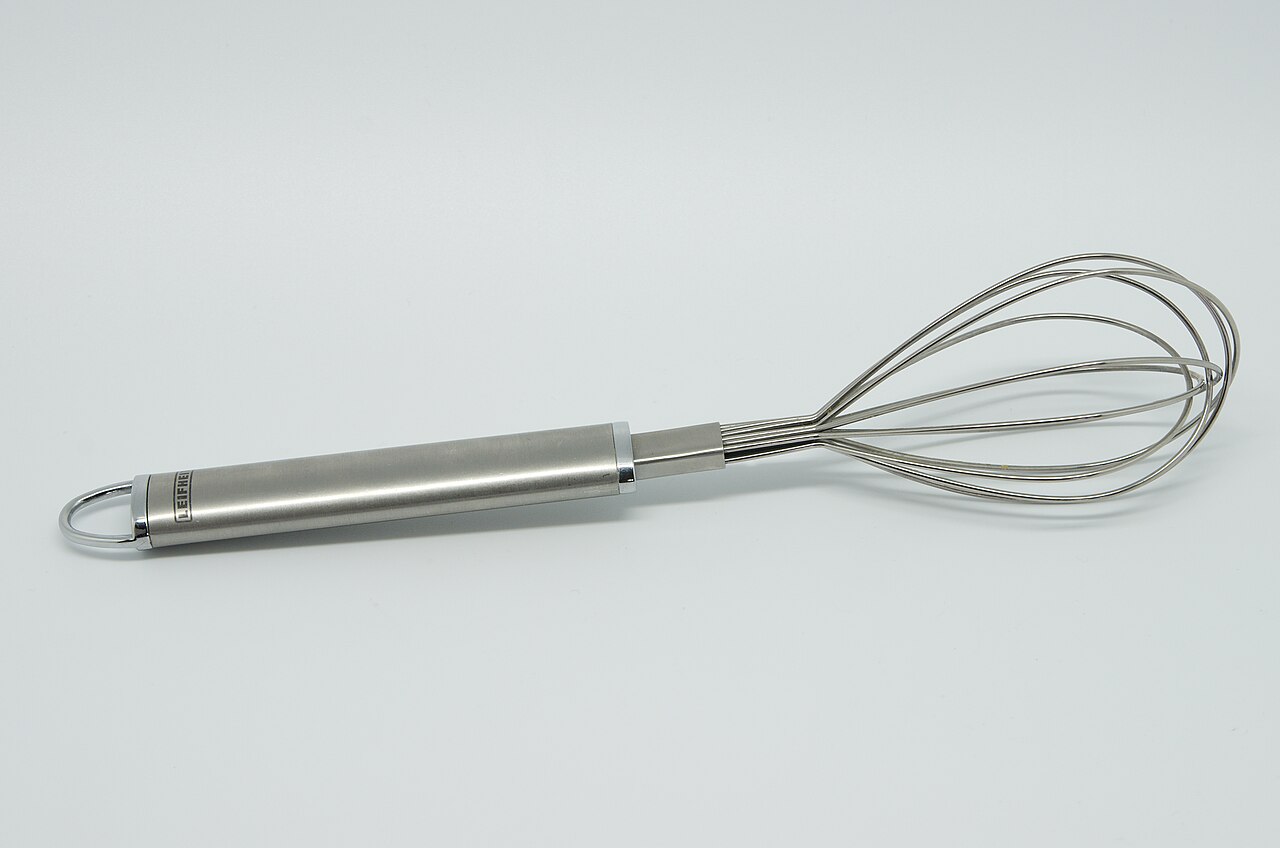 A stainless steel balloon whisk, used for beating eggs and mixing sauces